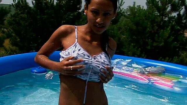 Super hot teen chick with fit sexy body is swimming naked in the pool