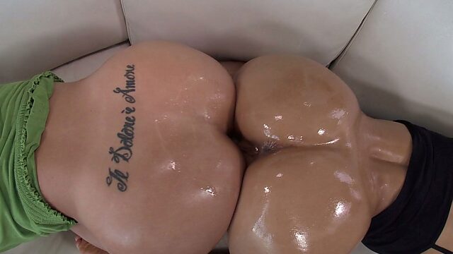 Two sexy round butts get glazed in oil in kinky porn clip