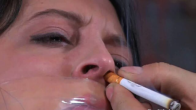 Perverted man ties up chick and puts cigarette in her nose