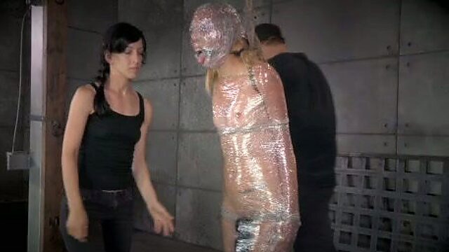 Chick in plastic wrap gets punished in the torture room