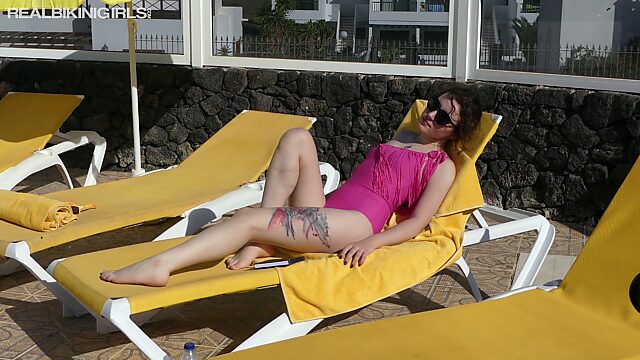 Topless bikini girl Bea Triss is flashing her yummy boobies by the poolside