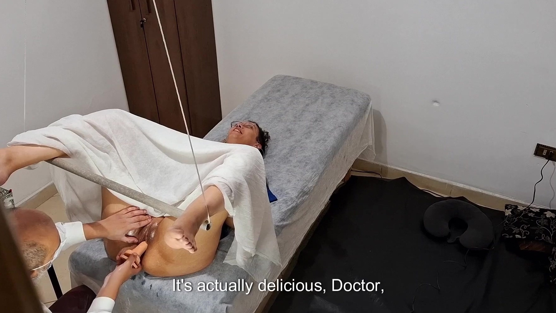Nasty doctor wearing uniform and mask demands from his patient to reveal he...