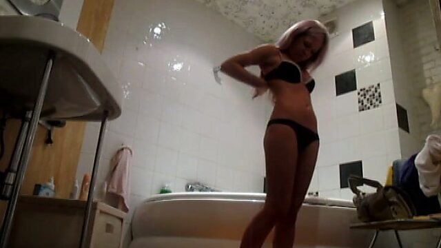 A hidden cam in the bath catches Ashley taking shower