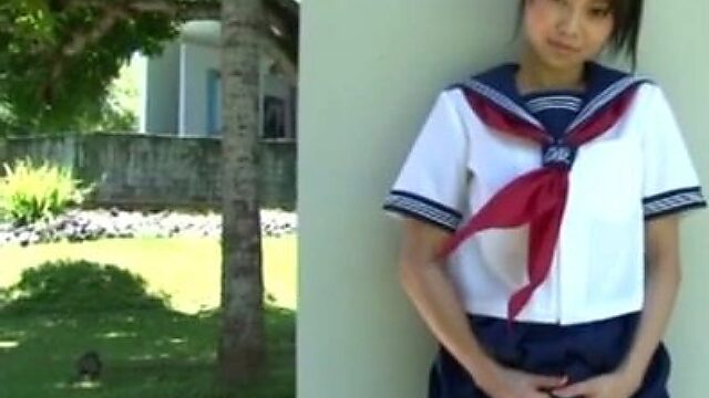 Whorish Japanese student Nami Mutou pulls up her skirt to rub pussy