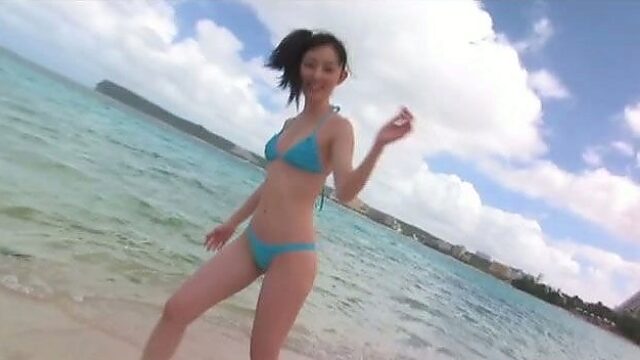 Spunked girlie Rina Akiyama goes to the beach to show her splendid body