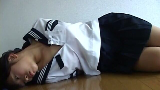 Foxy Japanese teen Noah lays on the floor with her hands cuffed