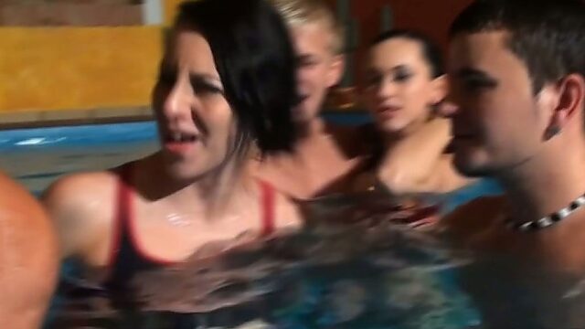 Sizzling whore give head in stinky pool in group sex orgy